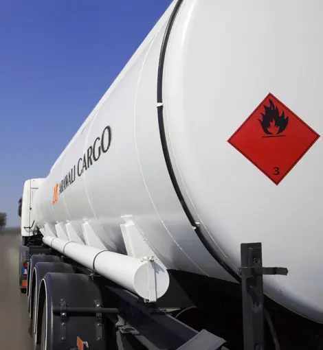 Arawali Hazardous Materials Transport L.L.C stainless steel chemical tanker on UAE highway — ADR certified